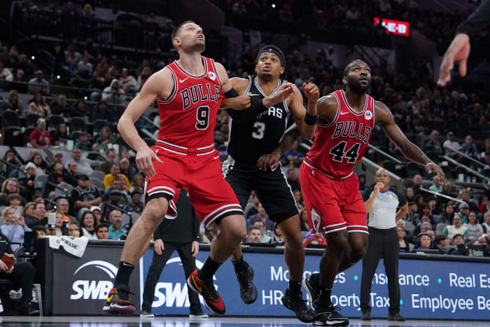 Chicago Bulls center Nikola Vucevic (9) and forward Patrick Williams (44) block out San Antonio Spurs forward Keldon Johnson (3) in the second half at the Frost Bank Center.